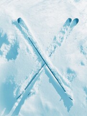 Poster - Skis are crossed in pristine white snow, highlighting a winter sport setup ready for enthusiasts at a mountain destination. Generative AI