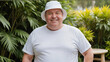 © QuoDesign - Plus size man wearing white t-shirt and white bucket hat standing in the garden