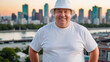 © QuoDesign - Plus size man wearing white t-shirt and white bucket hat standing on cityscape background