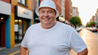 © QuoDesign - Plus size man wearing white t-shirt and white bucket hat standing on the street