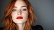 © svastix - A close-up of a woman with striking red hair, blue eyes, and freckles, staring confidently at the camera, highlighting luminous skin and vivid red lips.