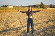 © javiindy - Embracing the feeling of freedom while surrounded by vibrant wildflowers in a sunlit field