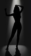 © Svetlana - Silhouette of a dancer expressing freedom and creativity under dramatic spotlight