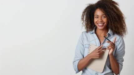 Sticker - a smiling african american woman holding a notebook and a pen