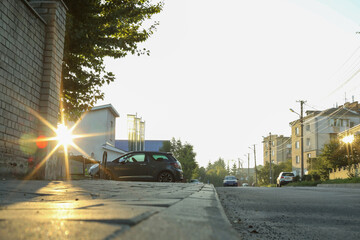 Wall Mural - beautiful view of city with trees and parked cars in morning