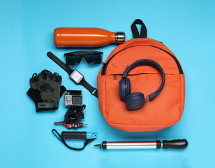 Poster - Flat lay composition with bicycle accessories on light blue background