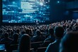 © Denis Tuev - a large, modern auditorium filled with professionals attending a technical conference