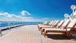 © Iona - Sun-kissed deck chairs perched on a cruise ship deck under a vivid blue sky, promising relaxation and adventure at sea.