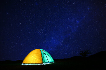 modern camping tent in wilderness at night