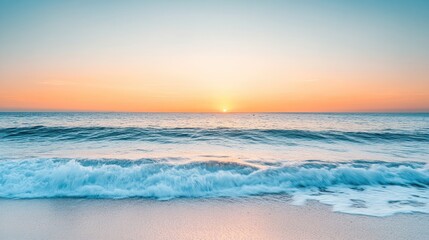 Wall Mural - a tranquil beach horizon at sunset with gentle waves and a clear sky transitioning into evening ligh