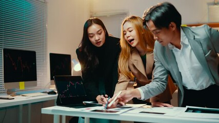 Fototapete - Team of business professionals is engaged in a discussion, analyzing financial data and charts on a digital tablet and laptop in their office