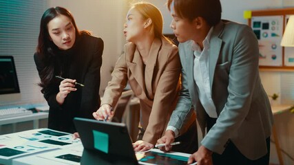 Fototapete - Diverse team of business professionals collaborates around a touchscreen table, reviewing data and strategizing on a project