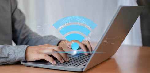 Wall Mural - wifi icon on businessman's hand, wireless communication concept, business, society, global