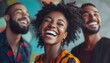 © Jojo* - Three friends laughing together in front of a colorful wall