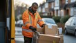 © Supriyanto - A delivery worker organizes packages outside a van on a residential street.