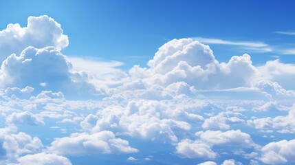 a tranquil blue sky with large, billowing clouds casting shadows