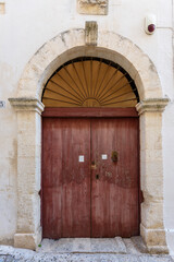 Old authentic vintage closed front door in Ostuni, Puglia, Italy