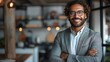© amixstudio - Confident Businessman in Modern Office