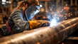 © sattawat - Professional female welder weld steel pipe .
