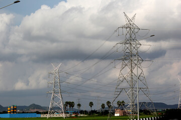 Powerline cables over the blue sky