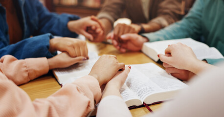 Bible study, holding hands and group with faith, praying and friends with belief, Christian and God. Respect, spiritual and circle of people, table and worship of holy spirit, guide and learning