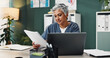 © LuxeShutter24/peopleimages.com - Doctor, laptop and mature woman with paperwork in office for healthcare, research or patient records. Medical professional, reading and work with info by tech for diagnosis review, report or feedback