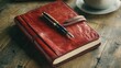 © P.G - A red leather journal with a fountain pen resting on its cover, set on a wooden desk.