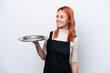 © luismolinero - Young Russian waiter with tray isolated on white background looking side