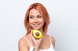 © luismolinero - Young Russian girl isolated on white background holding an avocado while smiling. Close up portrait