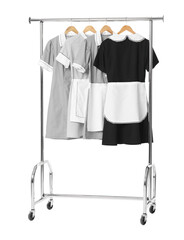 Wall Mural - Maids' uniforms on clothing rack isolated on white