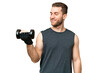 © luismolinero - Young sport man making weightlifting over isolated chroma key background with happy expression