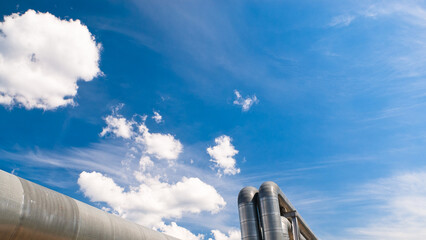 pipeline, blue sky and clouds in the background