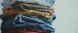 © Ai Studio - A neatly stacked assortment of vibrantly colored clothes creates a cozy, warm atmosphere, reflecting comfort and daily routine.