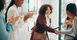 © KayExam/peopleimages.com - Business, women and applause at office with handshake for recruitment, welcome and agreement. Employees, people and smile or happy for job well done, promotion and career opportunity at meeting