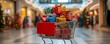 © Ytnart - A shopping cart filled with colorful presents, creating a festive atmosphere in a mall decorated for the holiday season.