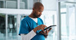 © peopleimages.com - Black man, nurse and clinic with tablet on telehealth for patient appointment, consultation and information. Male person, employee and serious with browsing internet for healthcare, data and records