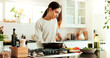 © HockleyM4/peopleimages.com - Cooking, woman and kitchen knife with chopping board, healthy food and relax in home with smile at counter. Diet, nutrition and vegetables with meal prep, happy and brunch with health and wellness