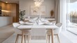 © Prostock-studio - A stylish dining area features a large white table set with fine china and glassware, surrounded by comfortable chairs