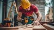 © elimicel - A construction worker using a drill on wooden planks at a building site.