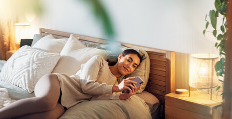 Poster - Phone, relax and woman on bed in home with social networking, browsing and swiping on dating app. Calm, rest and female person laying in bedroom with cellphone for reading online blog in apartment.