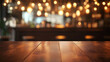 © Abdul - Polished wooden table with bokeh lights in cozy interior. Warm ambient lighting background for restaurant, café, or bar design. Rustic wooden surface with glowing blurred lights for product display