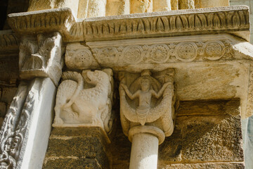 the facade and details of the facade of a medieval fortress in Europe. A monastery in northern Italy