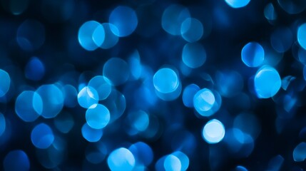 abstract of glowing blue bokeh on dark blue background