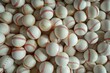 © Vii - A collection of baseballs stacked on a flat surface