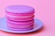 © Nataliia_Trushchenko - Pink macaron is on a white plate. There are three other pink macarons on the plate. food photography , clean background in pastel colors, freestyle composition, fresh and whimsical
