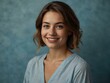 © claudunia - Portrait of a woman with a gentle smile, serene blue background.