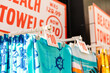 © Austockphoto - beach towels for sale at a tourist shop in the Gold Coast