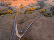 © Austockphoto - Aerial view of golden evening light on country roads running through dry rural farmland