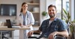 © Tadeusz - Smiling Caucasian man in wheelchair with female healthcare professional nearby.