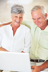 Wall Mural - Senior couple, laptop and home for blog, surfing social media and internet for communication. Elderly people, relax and together for bonding in living room, reading funny ebook and streaming comic